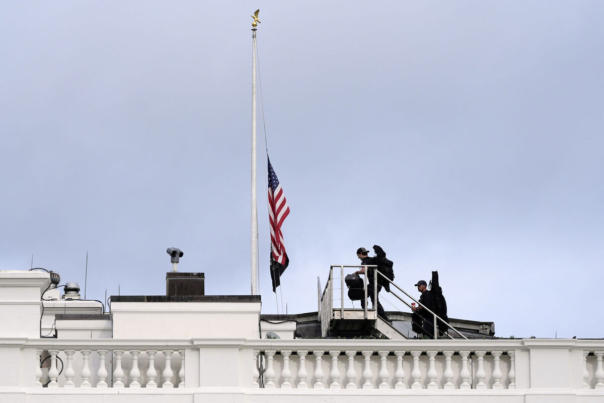 Members of the U.S. Secret Service counter sniper team walk onto the roof of the White House after the American flag at the White House in Washington, was lowered to half-staff after Charlie Kirk, the CEO and co-founder of Turning Point USA, was killed at an event in Orem, Utah, Wednesday, Sept. 10, 2025. (AP Photo/Alex Brandon) Members of the U.S. Secret Service counter sniper team walk onto the roof of the White House after the American flag at the White House in Washington, was lowered to half-staff after Charlie Kirk, the CEO and co-founder of Turning Point USA, was killed at an event in Orem, Utah, Wednesday, Sept. 10, 2025. (AP Photo/Alex Brandon)