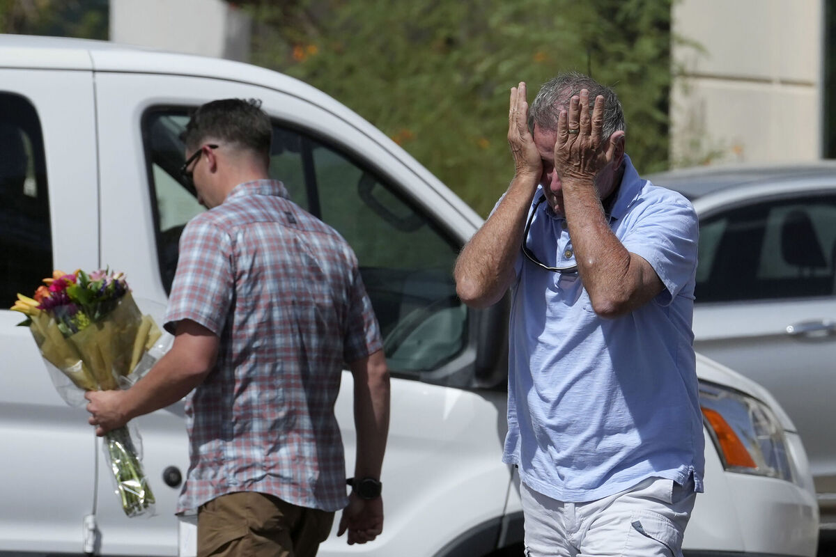 A well-wisher is overcome after dropping off flowers at the national headquarters of Turning Point USA after the shooting death of Charlie Kirk, CEO of the organizaion, during a Utah college event Wednesday, Sept. 10, 2025, in Phoenix. (AP Photo/Ross D. Franklin) A well-wisher is overcome after dropping off flowers at the national headquarters of Turning Point USA after the shooting death of Charlie Kirk, CEO of the organizaion, during a Utah college event Wednesday, Sept. 10, 2025, in Phoenix. (AP Photo/Ross D. Franklin)