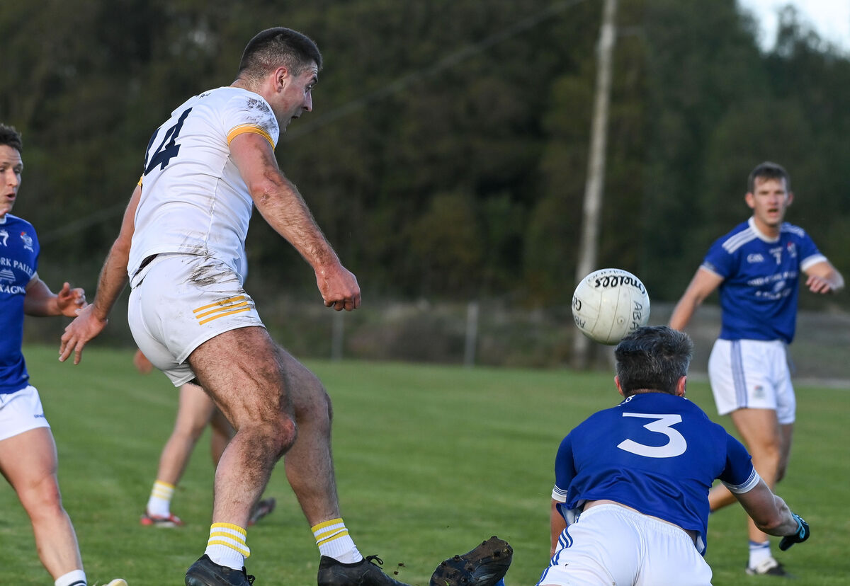  Bandon's Michael Cahalane has his shot blocked by Naomh Aban's Dara O Loingsigh during their Premier IFC clash at Kilmichael.