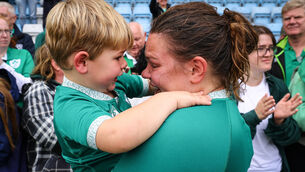 <p>GENERATION GAME: Ireland's Ellena Perry with her son Bert dejected after the game. Pic: INPHO/Ben Brady</p>