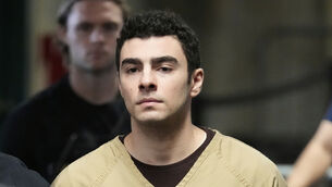 Luigi Mangione is escorted into court in New York on Tuesday (Seth Wenig/AP)