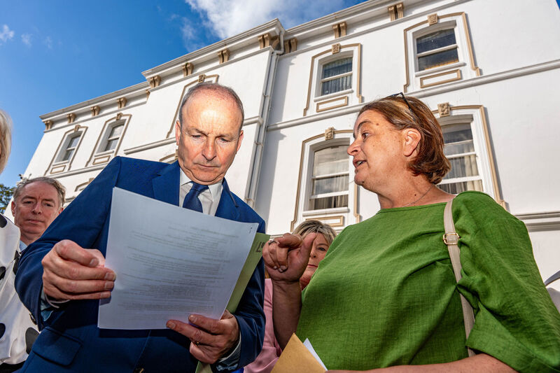 Antoinette Burke (right), mother of Katie, confronts Taoiseach Micheál Martin (left) outside the Fianna Fail's parliamentary party annual think-in at the Rochestown Park Hotel in Co Cork. Katie opened up about the pride she felt after her mother confronted the Taoiseach. Photo: Noel Sweeney/PA Antoinette Burke (right), mother of Katie, confronts Taoiseach Micheál Martin (left) outside the Fianna Fail's parliamentary party annual think-in at the Rochestown Park Hotel in Co Cork. Katie opened up about the pride she felt after her mother confronted the Taoiseach. Photo: Noel Sweeney/PA