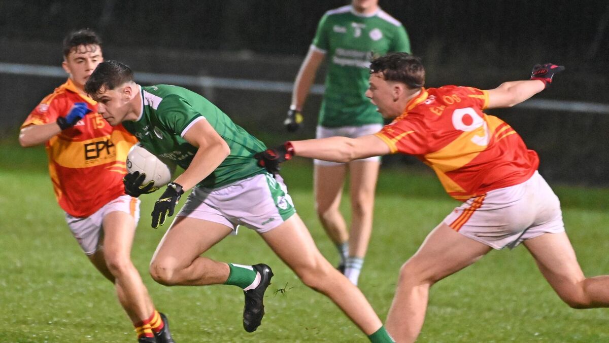 RENIGNING CHAMPIONS: Ballincollig's Alex Rose breaks from Éire Óg's Colm Sheehan during the Rebel Óg Premier 1 MFC semi final at The Mardyke. Picture: Eddie O'Hare