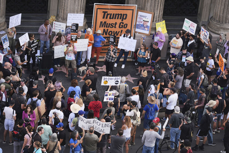 Demonstrators hold signs outside El Capitan Entertainment Centre, where the late-night show "Jimmy Kimmel Live!" is staged, Thursday, Sept. 18, 2025, in Los Angeles. Picture: AP Photo/Damian Dovarganes