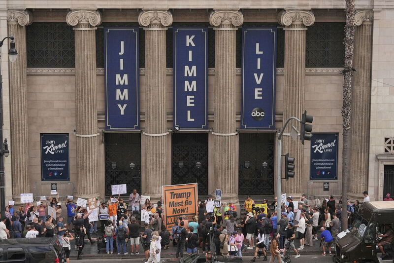 Demonstrators hold signs outside El Capitan Entertainment Centre, where the late-night show "Jimmy Kimmel Live!" is staged, Thursday, Sept. 18, 2025, in Los Angeles. Picture: AP Photo/Jae C. Hong