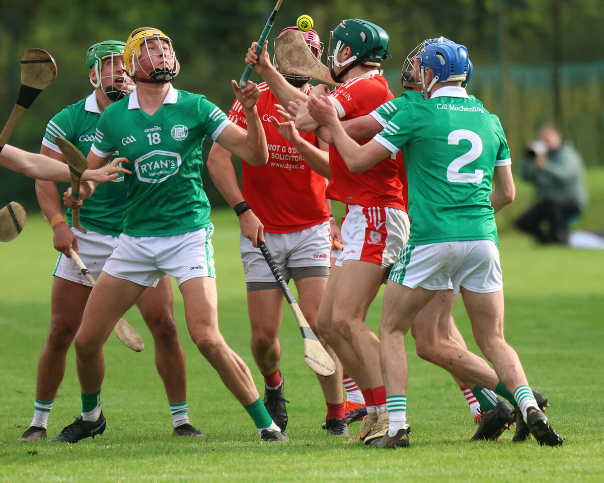 Kilmallock's Sean carroll and Mark O'Dwyer of Monaleen search for the sliotar in their Limerick senior hurling championship quarter-final. Pic: Brendan Gleeson