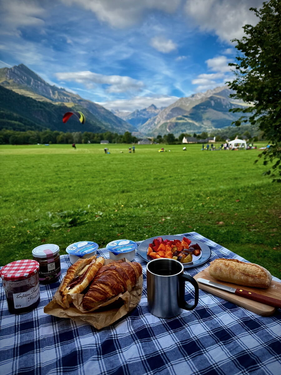 Breakfast at the campsite of paragliders at Camping Azun Nature while watching La Fête du Ciel in the Pyrenees. Breakfast at the campsite of paragliders at Camping Azun Nature while watching La Fête du Ciel in the Pyrenees.