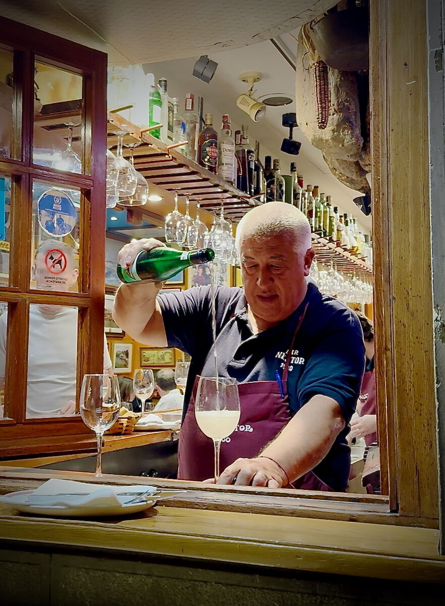 Pouring txakoli at Bar Nestor in San Sebastian. Pouring txakoli at Bar Nestor in San Sebastian.