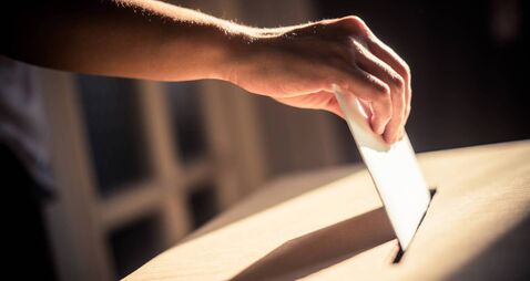Conceptual image of a person voting during elections