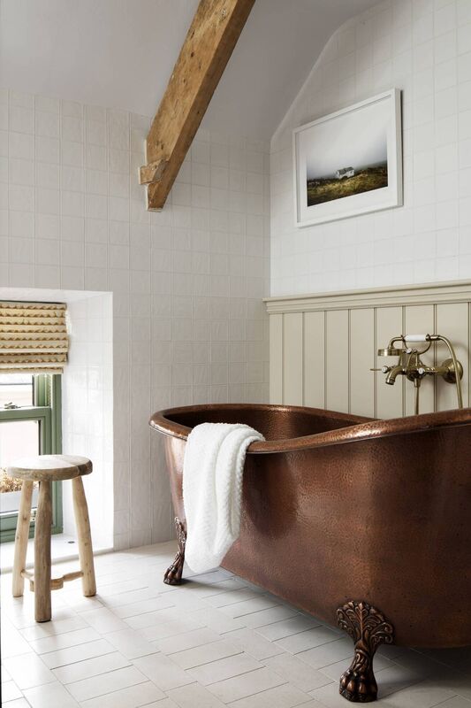 The copper bathtub adds a touch of luxe.