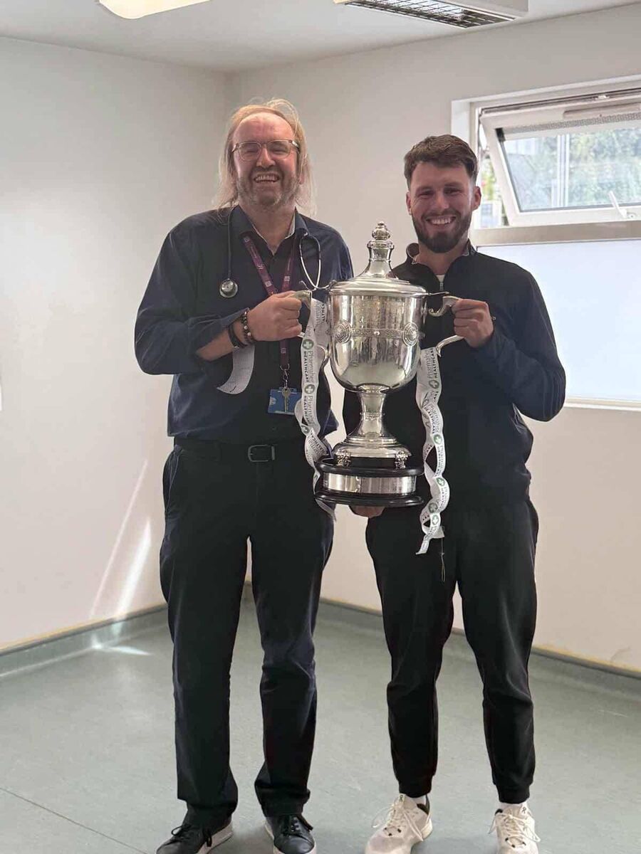 Golfer David Howard reunites with Professor Barry Plant. 