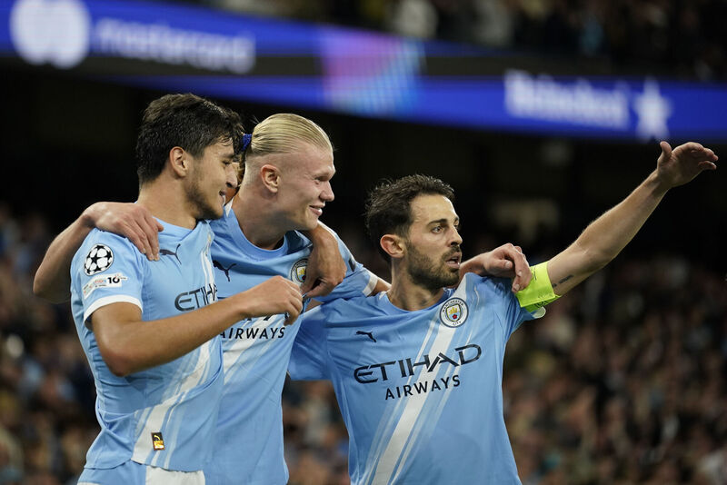 Manchester City's Erling Haaland, centre, celebrates with Abdukodir Khusanov, left, and Bernardo Silva after scoring against Napoli. Pep's new way centres around Haaland and Khusanov more than Silva (AP Photo/Dave Thompson) Manchester City's Erling Haaland, centre, celebrates with Abdukodir Khusanov, left, and Bernardo Silva after scoring against Napoli. Pep's new way centres around Haaland and Khusanov more than Silva (AP Photo/Dave Thompson)