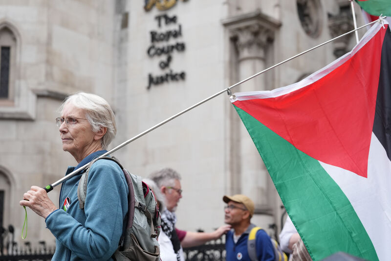 Campaigners outside The Royal Courts Of Justice in central London last July, where a judge was ruling on whether the co-founder of Palestine Action, Huda Ammori, can proceed with a legal challenge against the home secretary's decision to proscribe the group as a terrorist organisation. 