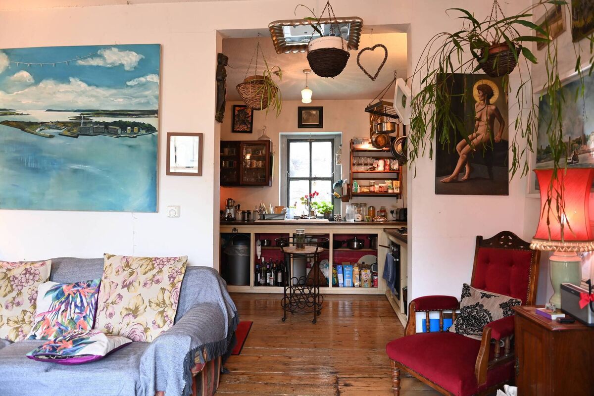 The first-floor living area, opening into the kitchen to the rear. 