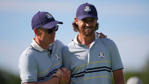 Europe captain Luke Donald hugs Tommy Fleetwood on the 11th hole at Bethpage Black golf course (Lindsey Wasson/AP)