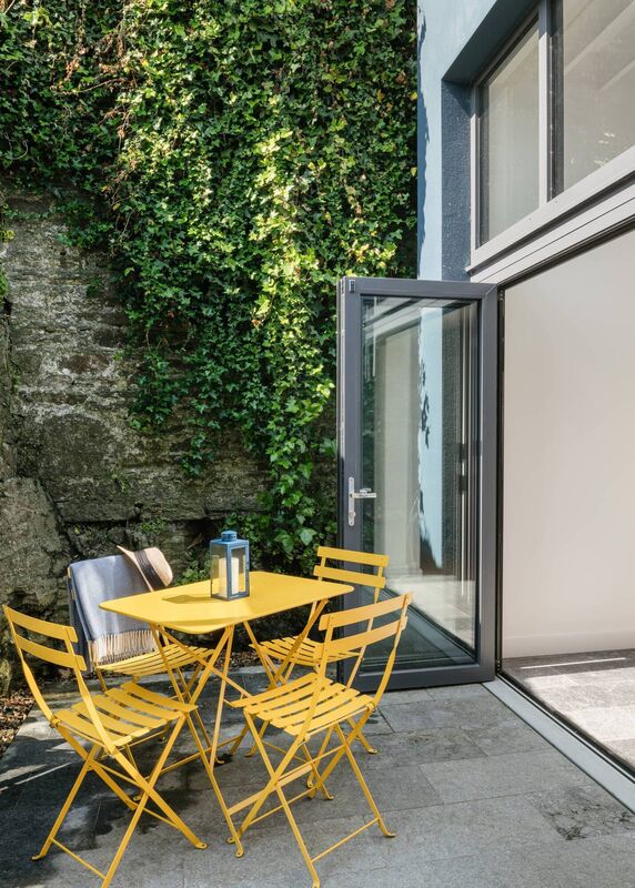 The extended and renovated Kinsale end-of-terrace residence blends the property's indoor and outdoor space.