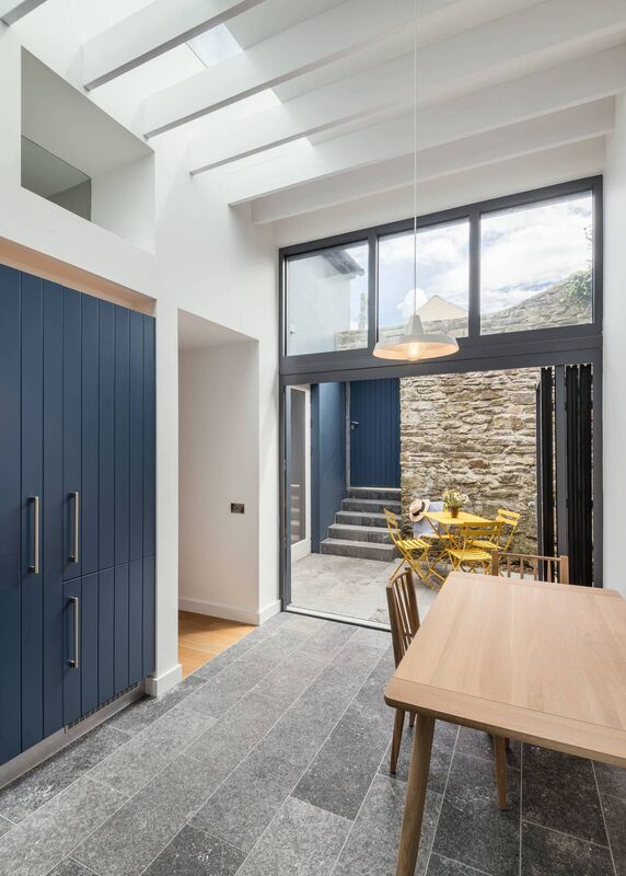 'The raised ceiling height, floor-to ceiling windows and roof light floods the space with light, creating a wonderful space to spend time in,' says the architect. 