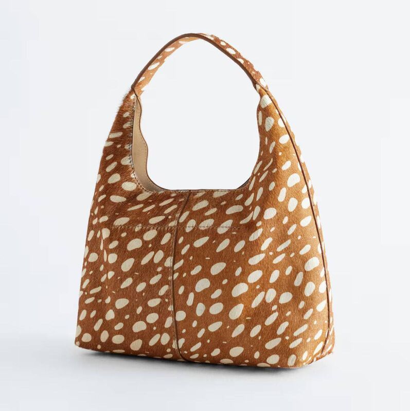 Tactile leather shoulder bag in deer print, & Other Stories, €149 Tactile leather shoulder bag in deer print, & Other Stories, €149