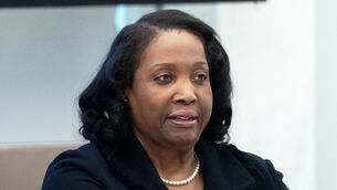 Federal Reserve Board of Governors member Lisa Cook listens during an open meeting of the Board of Governors in Washington (Mark Schiefelbein/AP)
