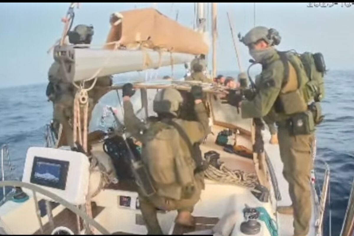 This frame grab from video released by the Global Sumud Flotilla shows Israeli navy soldiers aboard one of the flotilla's vessels after it was intercepted as it approached the coast of Gaza early Thursday, Oct. 2, 2025. (Global Sumud Flotilla via AP)