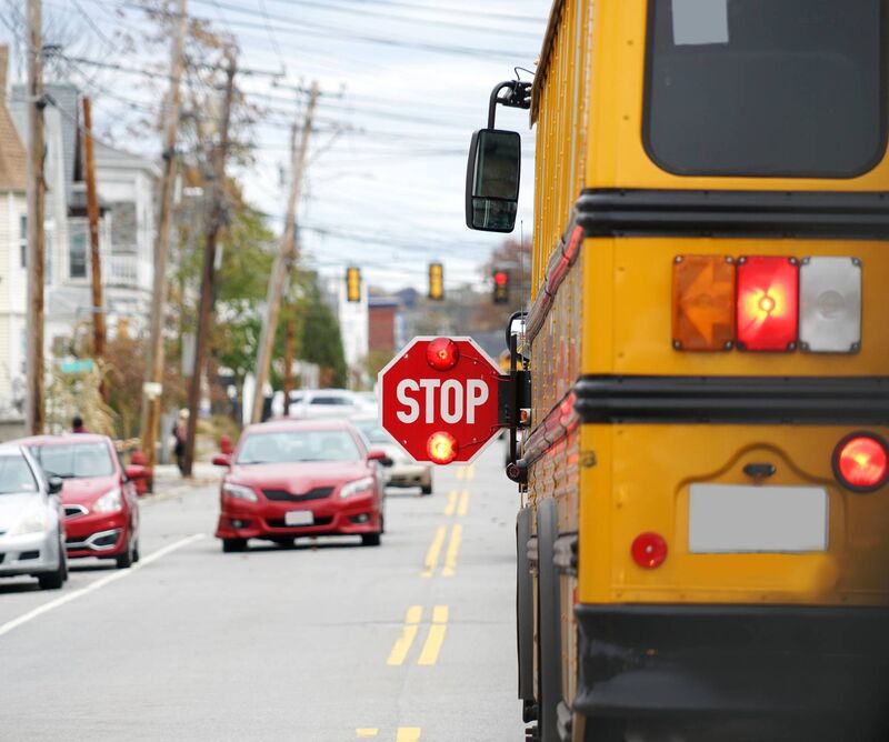 A school bus in the US with a mandatory illuminated stop sign. Picture: iStock