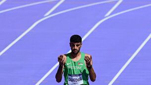 <p>STOP. THAT'S ALL: Palestinian Mohammed Dwedar prays before running the 800m. Pic: MARTIN BERNETTI/AFP via Getty Images</p>