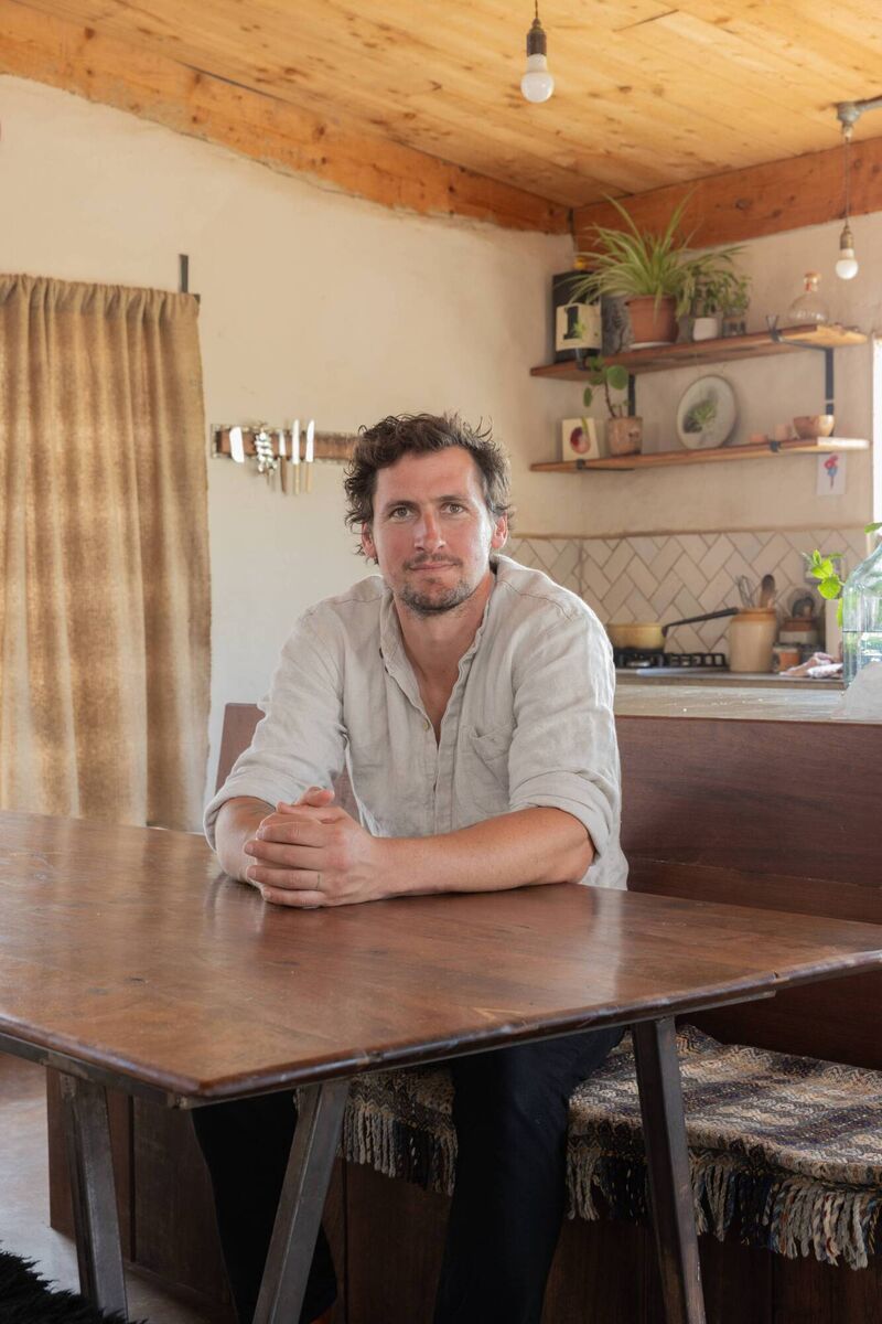Harrison Gardiner at his kitchen table, where he originally started his Build School. Picture: Shantanu Starick