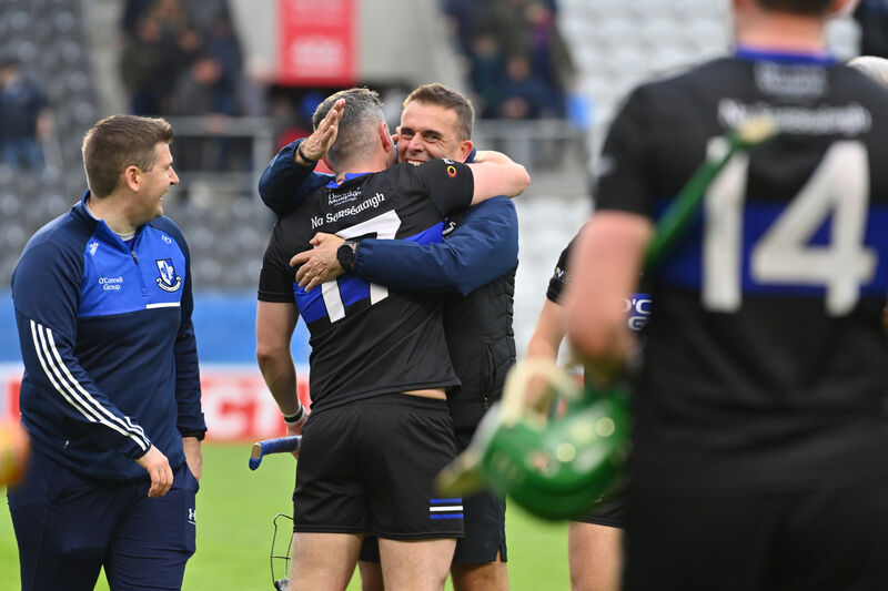  Sarsfields manager Johnny Crowley celebrates  with Eoghan Murphy after the match. Pic: Dan Linehan