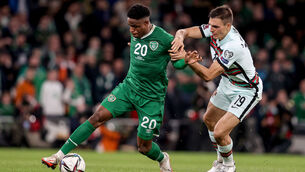 <p>Ireland's Chiedozie Ogbene with Joao Palhinha of Portugal. Pic: Dan Sheridan/Inpho</p>