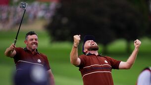 <p>Shane Lowry and Rory McIlroy react after their match win on the 18th hole at Bethpage Black golf course during the Ryder Cup golf tournament, Saturday, Sept. 27, 2025, in Farmingdale, N.Y. (AP Photo/Matt Slocum)</p>
