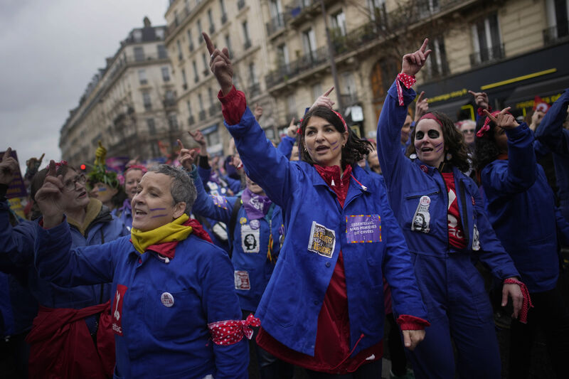 Women march during a demonstration as part of International Women's Day, Wednesday, March 8, 2023, in Paris. Feminist activists see the pension reform as unfair to women, especially because they say it would further deepen gender inequalities faced during their careers. Women march during a demonstration as part of International Women's Day, Wednesday, March 8, 2023, in Paris. Feminist activists see the pension reform as unfair to women, especially because they say it would further deepen gender inequalities faced during their careers.