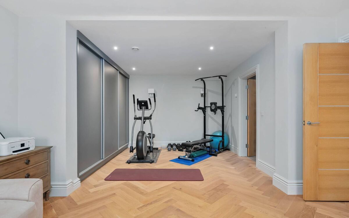 In-law suite in use as a home office and gym In-law suite in use as a home office and gym