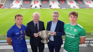 <p>Pat Horgan, Chairperson Cork GAA and Brendan Harrington, McCarthy Insurance Group CEO with Steven Sherlock, St. Finbarr's and Liam O'Connell, Ballincollig. Pic: Jim Coughlan.</p>