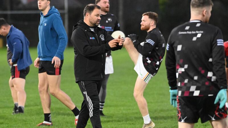FINAL PREPARATIONS: St Nick's coach Eoin O'Sullivan puts the players through their paces in the warm-up. Picture: Eddie O'Hare