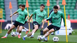 <p>IN SYNC: Seamus Coleman, centre, with Mikey Johnston, right, and Dara O'Shea, left, during training. Picture: Stephen McCarthy/Sportsfile</p>