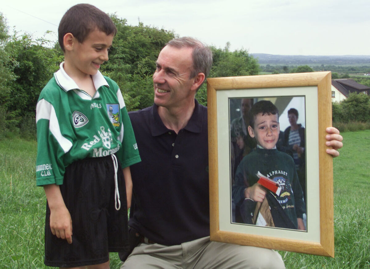 Yura Burmantau, 8, from Chernobyl with 'Irish Examiner' photographer Kieran Clancy presenting him with a framed photo of himself in 2001. Yura Burmantau, 8, from Chernobyl with 'Irish Examiner' photographer Kieran Clancy presenting him with a framed photo of himself in 2001.