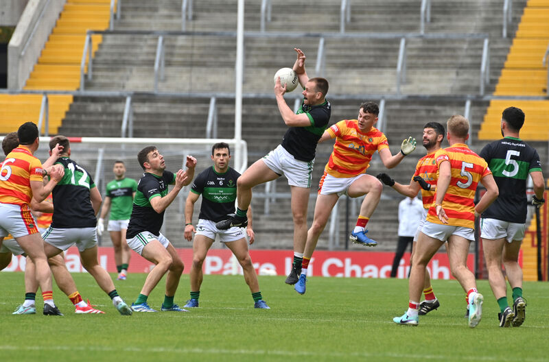  Alan O'Donovan, Nemo Rangers winning this high ball from Eoghan Collins, Newcestown. Pic: Dan Linehan