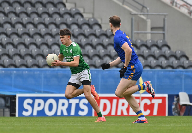  Jamie Burns, St Finbarr's about to tackle Ben O'Connell, Ballincollig, in their McCarthy Insurance Group Senior FC semi-final match at Páirc Uí Chaoimh. Pic: Dan Linehan