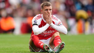 <p>Martin Odegaard twice attempted to carry on after receiving treatment before being replaced by Martín Zubimendi in the 2-0 win over West Ham. 	Picture: John Walton/PA </p>