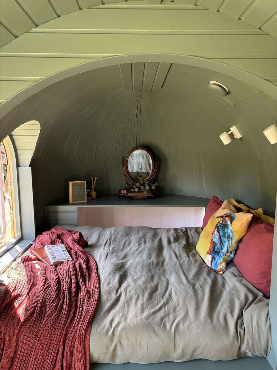 The bedroom of the Kingfisher's Residence cabin.