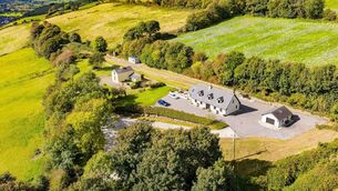 <p>Original Station Master's House (left) and contemporary home (right) at the former Ballinhassig Railway Station</p>