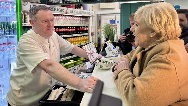 <p>Presidential candidate Heather Humphreys campaigning at a fish and chip shop Leo Burdock in Howth, Dublin (PA/Bairbre Holmes)</p>