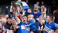 Conor O'Sullivan lifts the Sean Óg Murphy trophy 19/10/2025