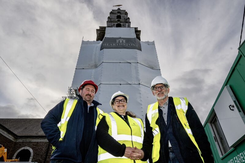 Architect Peter Bourke, Reverend Meghan Farr and Hearthstone managing director Keith Starr stand before the scaffolding around Shandon Bell Tower, where Cork’s iconic 'four-faced liar' clocks have been removed for the first time in decades. Picture Chani Anderson