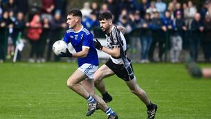 <p>REPLAY: Tom Buckley with possession in midfield for Aghinagh in the Ross Oil sponsored Junior A Football Championship final. Pic: Larry Cummins</p>