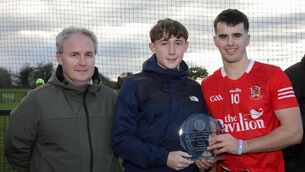 <p>Cormac and Cillian Fitzgearld of Fitzgearld &amp; Partners present the Man of the Match award to Evan O'Connor. Pic: David Creedon.</p>
