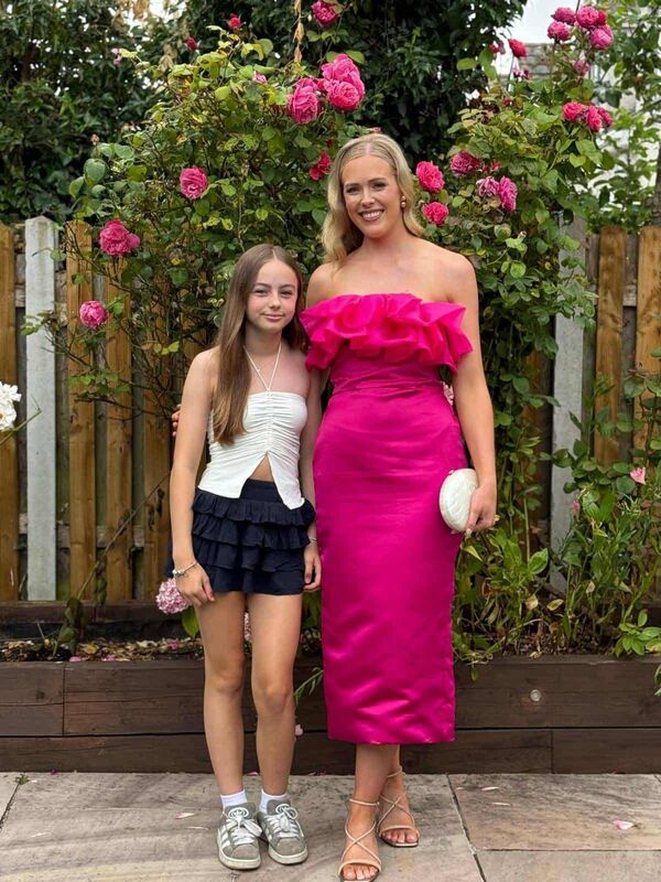  Erin Hopkins, left, with the dress she made for her sixth class maths teacher Caoimhe Mellon.