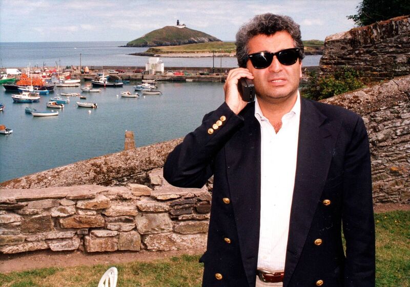 Producer Barry Navidi taking a call on his mobile phone — then a brand-new innovation — during the filming of 'Divine Rapture' in East Cork in July 1995. Picture: Denis Minihane/Irish Examiner Archive