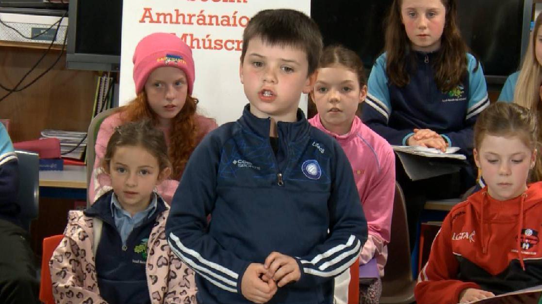 Liam Mac Suibhne, a pupil of Scéim Aisling Gheal, sings during filming of  Aisling fé Bhláth.