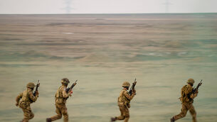 Servicemen run during the Steadfast Dart 2025 exercise, involving some 10,000 troops in three different countries from nine nations, at a training range in Smardan, eastern Romania (Vadim Ghirda/AP) Servicemen run during the Steadfast Dart 2025 exercise, involving some 10,000 troops in three different countries from nine nations, at a training range in Smardan, eastern Romania (Vadim Ghirda/AP)